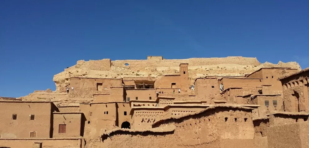 Kasbah Ait Ben Haddou, Morocco as seen from below, against deep blue sky - gallery image for 7 day Morocco itinerary from Fes - "Walled Cities & Wide-Open Spaces
