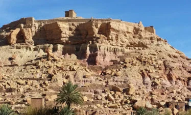 Kasbah Ait Ben Haddou seen atop a rocky mesa - gallery image for 8 day Morocco itinerary from Tangier to Marrakesh - Mountains, Medinas & Nomad Tents