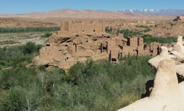 view of kasbah in a green valley in Kalaat M'Gouna - Valley of the Roses