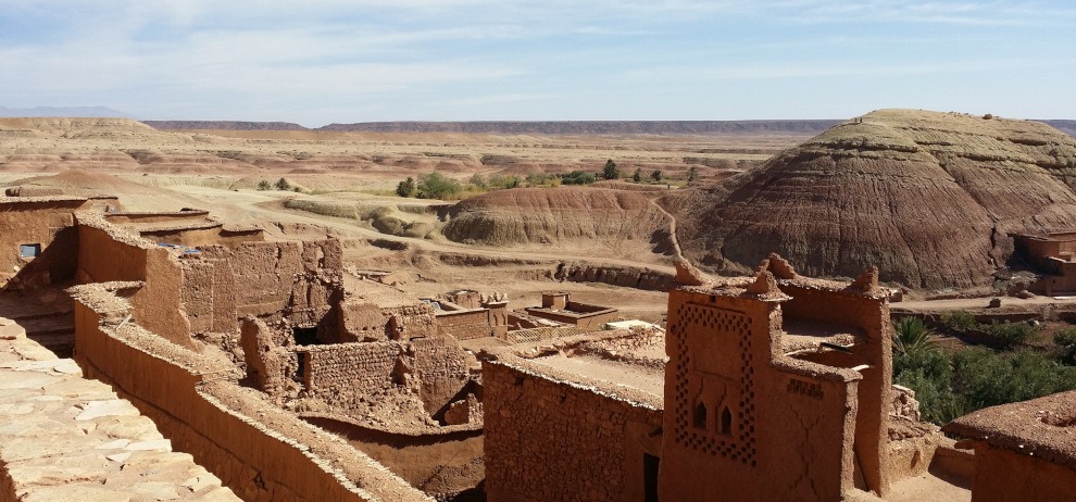view of buildings, valley and distant mountains from rooftops of Ait Ben Haddou