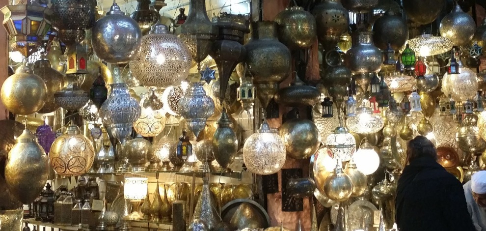 array of cut-metal lamps and lanterns in Marrakesh souk - gallery image for 7 day Morocco itinerary - "Walled Cities & Wide-Open Spaces"