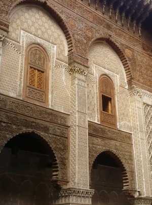 ornately decorated wall in ancient university in Fes medina