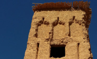 looking up at carved arches in mud-brick tower at Ait Ben Haddou