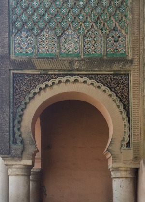 Meknes- detail of ornate stone & zelig tilework on the side archway of the historic Bab Mansour gate