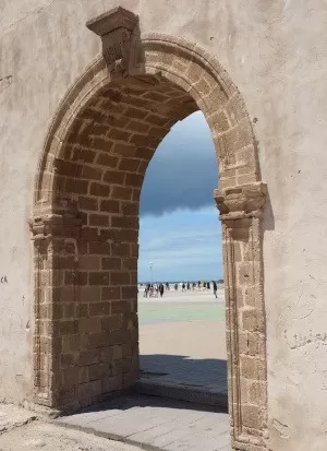 Essaouira-view of ocean & sky through stone gate in old city