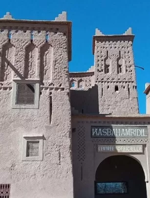 Skoura-front facade of Kasbah Amridil against bright blue sky