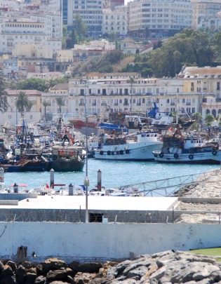 Tangier-view of fishing port, boats, with city on hill in background